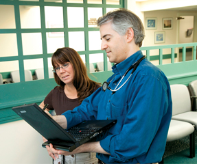 David S Gorelick ACP Member reviews electronic medical records EMRs with medical assistant Kim Knight The EMR system improves efficiency and allows reporting and sharing clinical data with speci